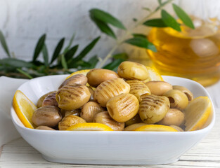 Grilled green olives. Tasty organic green olives in the plate.