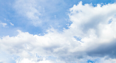 Wall Mural - scenic of white cumulus clouds floating above blue sky. forecast cloudscape before rain in bright da