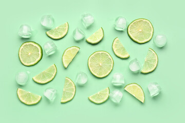 Lime slices with ice cubes on turquoise background