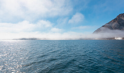 Wall Mural - arctic landscape of greenland in summer. beautiful view of mountains with snowy peaks and iceberg