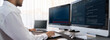 © InfiniteFlow - Software engineer working on application development on his computer display code and script on monitor at tech company office workplace. Application developer solving and writing code. Trailblazing