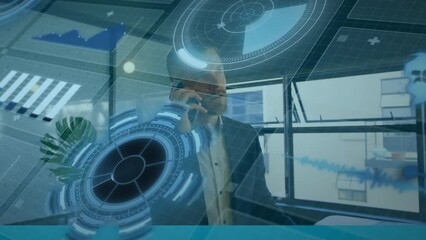 Poster - Animation of multiple graphs, map over caucasian businessman talking over smartphone in office
