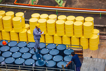 Male Worker Inspection Record Drum Oil Stock Barrels Yellow Vertical Or Chemical For Transportation Truck Male