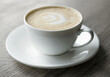 © oleh11 - Cup of hot cappuccino coffee on table