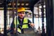 © kanpisut - Man worker at forklift driver happy working in industry factory logistic ship. Man forklift driver in warehouse area. Forklift driver sitting in vehicle in warehouse.