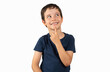 © cunaplus - Pensive kid looks away at copy space thinking isolated on a white background, funny kid lips hold finger near mouth conceiving some kind of joke, conceptual image