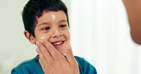 Canvas Print - Young boy, skincare and lotion with a smile from morning hygiene and cream. Laugh, kid and moisturizer with youth in a family home and bathroom with sunscreen and facial care and clean cosmetics