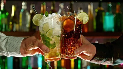 Poster - Super slow motion of cheering cocktail drinks in bar. Filmed on high speed cinema camera, 1000 fps. Bar with bottles on background. Ramp speed effect.