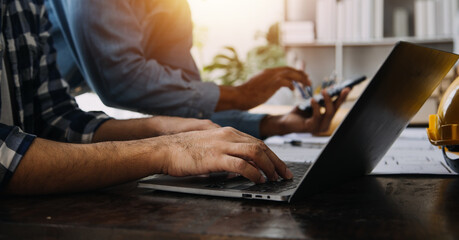 close up business woman using calculator and laptop for do math finance on wooden desk, tax, account