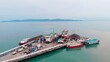 © ShantiMedia - Aerial top view Harbor with pier in Kenya in the middle of the ocean receives ships with fish Harbor in Kenya: fishermen on ships with fish and seafood Sale fresh fish from a ships with fish in Harbor