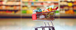© Michal - Shopping cart full of vegetables in the store. Generative AI
