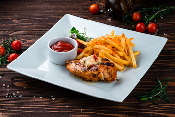 Sticker - Fried chicken fillet with French fries, onion, cherry tomatoes and ketchup, lunch.