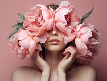 The Woman Is Holding Pink Flowers In Front Of Her Face