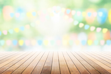 Wall Mural - Empty wooden table with party in garden background blurred.