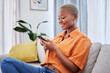 © Malik/peopleimages.com - House, phone or happy black woman on social media connected to internet with website notification. News, digital or African girl online typing or texting on networking mobile app to search content