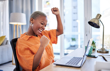 Businesswoman, laptop or winner with fist pump for winning, success or promotion bonus in home office. Happy black woman trader trading or cheering with prize, goal target or good news in remote work