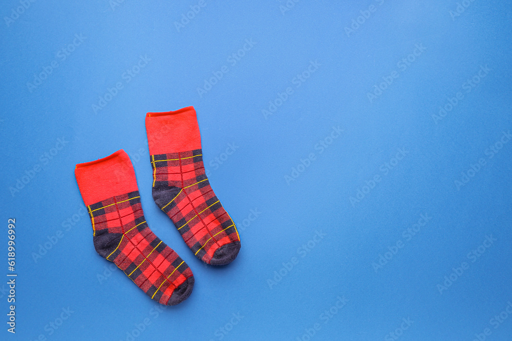 Pair of cotton socks on blue background