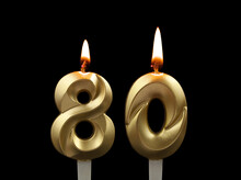 Burning Gold Birthday Candles Isolated On Black Background. Number 80.