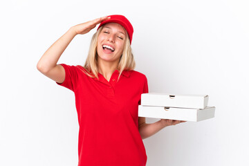 Wall Mural - Delivery woman holding pizzas isolated on white background smiling a lot