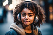  A young  girl listens to music in headphones.