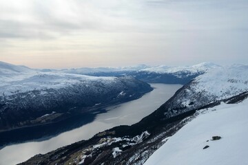 Sticker - Breathtaking view of a fjord between the snow-covered mountains in Andalsnes, Norway