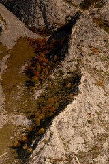 Wall Mural - Aerial shot of the rocky big mountains and mountainsides during the autumn season