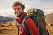 © CodrinAlexandru - handsome young man with beard backpack trekking outdoors laughing to the camera