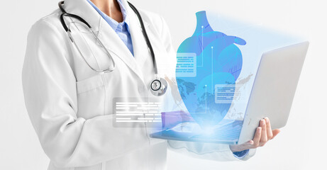 Fototapete - Cropped of woman doctor using laptop, examining human heart, collage