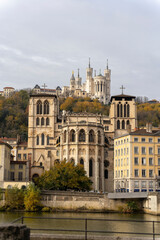 Wall Mural - A stunning view of Lyon, France captured from the river, showcasing the iconic Basilica of Notre-Dame de Fourvière perched atop the hill. A beautiful scene that captures the essence of this historic c