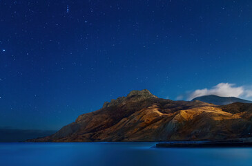 Wall Mural - Sea, mountains and night starry sky