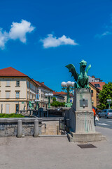 Wall Mural - A view at one end of the Dragon Bridge over the River Ljubljanica in Ljubljana, Slovenia in summertime