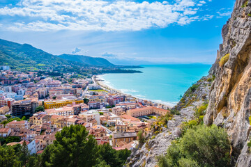 Wall Mural - Aerial view of Cefalu, medieval town on Sicily island, Italy. Seashore village with sandy beach, surrounted with mountains. Popular tourist attraction in Province of Palermo