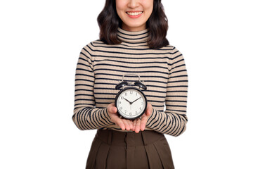 Poster - Happy Asian woman with sweater shirt holding alarm clock isolated on white background