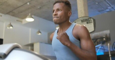 Poster - Muscular black man running on treadmill in gym