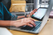 © Garun Studios - Concept programmer, Developer programming and coding technology, Hand Close up asianwoman using laptop and tablet artificial coding business data analytics programming.