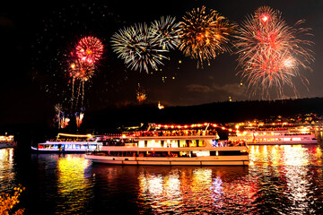 Poster - Rhine in Flames in Germany is an event where passing ships are decorated with lights and fireworks illuminate the river at night.