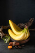front view fresh yellow bananas on a dark background exotic ripe darkness taste photo tropical fruit berry