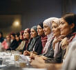 A horizontal side view shot of Turkish women joining the seminar for women