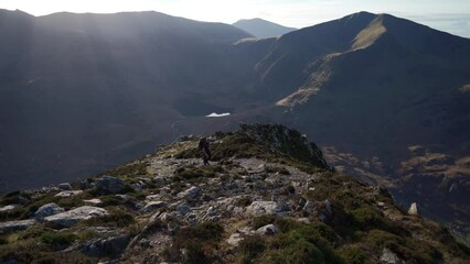 Wall Mural - A backpacker hiking the beautiful mountains of North Wales UK