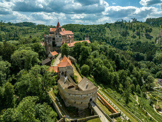 Canvas Print - Aerial view of Pernstejn castle with barbican and moat protecting the entrance