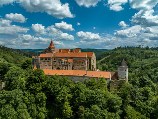 Wall Mural - Aerial view of circular corner defensive tower and Gothic palace building at Pernstejn castle