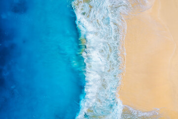 Wall Mural - coast as a background from top view. waves and beach. aerial landscape. azure water background from 
