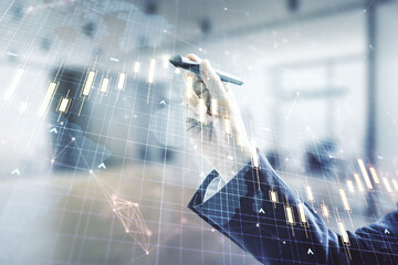 Poster - Multi exposure of trader hand with pen working with virtual abstract financial chart and world map on blurred office background, research and analytics concept