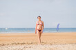 © Sangiao_Photography - Summer holidays relax and wellbeing. Bikini body positivity Hispanic mid woman at beach. Asturias