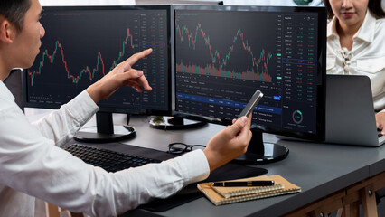 Poster - group of traders discussing on office desk, monitoring stock market on monitor at office workplace. 