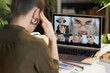© Alliance - Seen from behind modern woman with laptop having video call