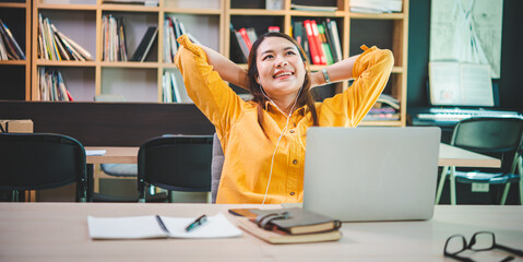 Wall Mural - businesswoman is doing a relaxing pose to relieve fatigue after working for a long time.