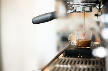 Wall Mural - Iced coffee in plastic cup on table in coffee shop