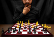 © Narayan - latin man with beard challenging in chess game, chess concept