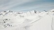 People snowboarding skiing at ski resort. Skiers, snowboarders riding snowy mountain slope. Outdoor winter sport and scineric panoramic view.